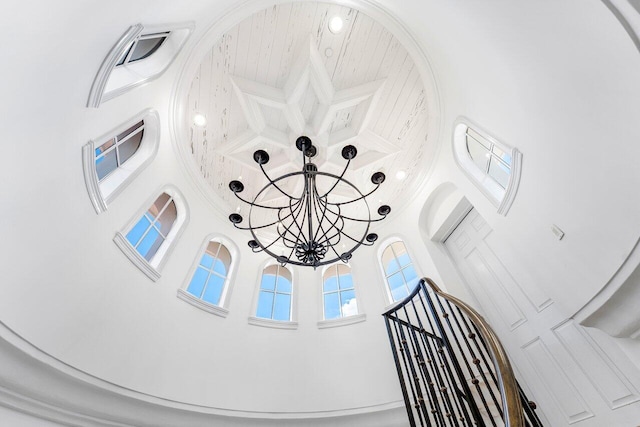 interior details featuring an inviting chandelier