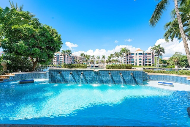 view of pool with pool water feature