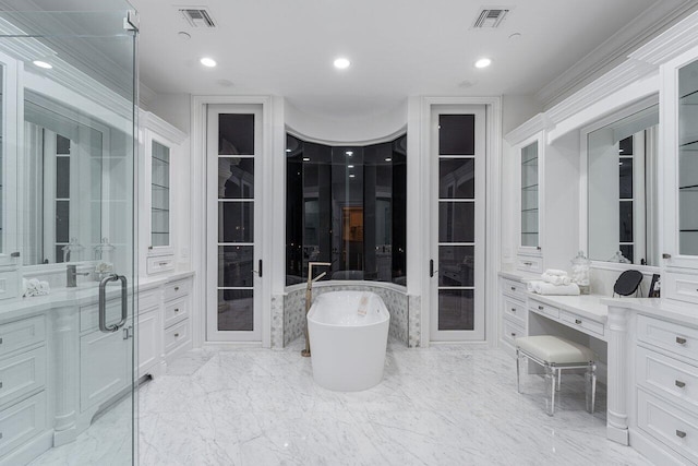 bathroom featuring vanity, a tub, and french doors