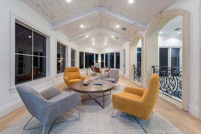 interior space featuring light wood-type flooring, vaulted ceiling with beams, and wooden ceiling