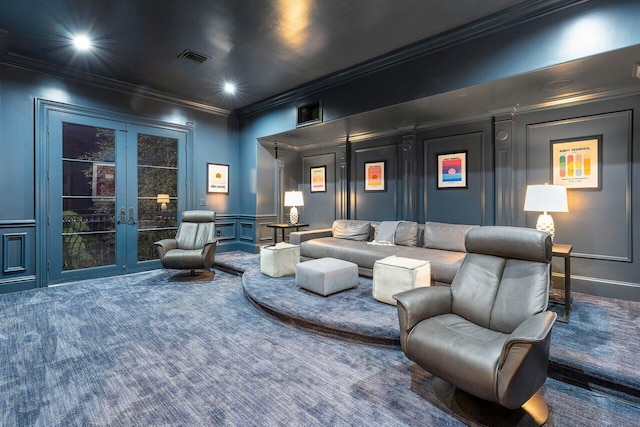 home theater room featuring dark colored carpet, french doors, and ornamental molding