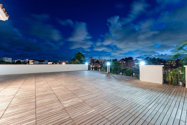 patio terrace at dusk with a balcony