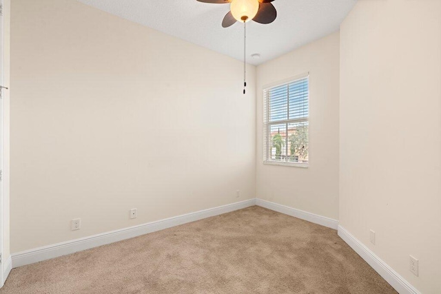 unfurnished room featuring ceiling fan and light colored carpet