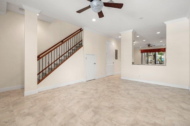 unfurnished living room featuring crown molding, decorative columns, and ceiling fan