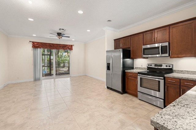 kitchen featuring ceiling fan, a textured ceiling, appliances with stainless steel finishes, light stone countertops, and crown molding