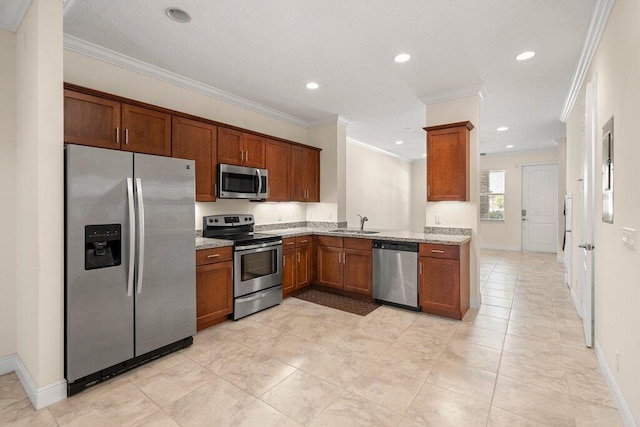 kitchen featuring appliances with stainless steel finishes, light stone countertops, light tile patterned floors, crown molding, and sink