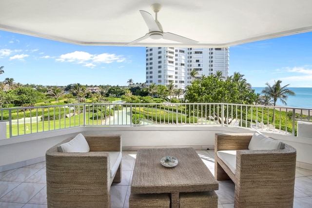 balcony with an outdoor hangout area and a water view