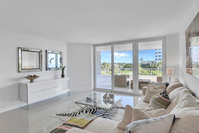 living room featuring light tile patterned floors and a healthy amount of sunlight