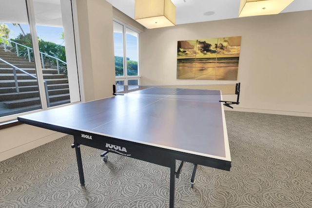 recreation room featuring light colored carpet