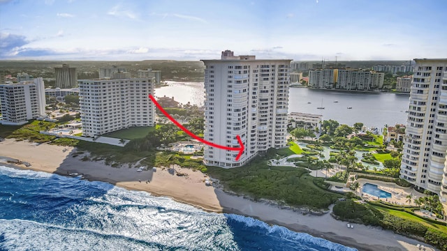 drone / aerial view featuring a view of the beach and a water view