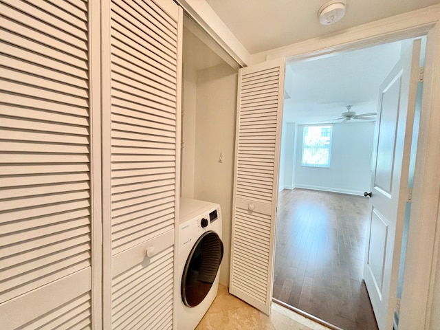 laundry room featuring light hardwood / wood-style floors, ceiling fan, and washer / clothes dryer