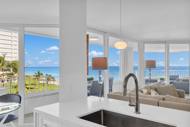 kitchen featuring a water view, plenty of natural light, and sink