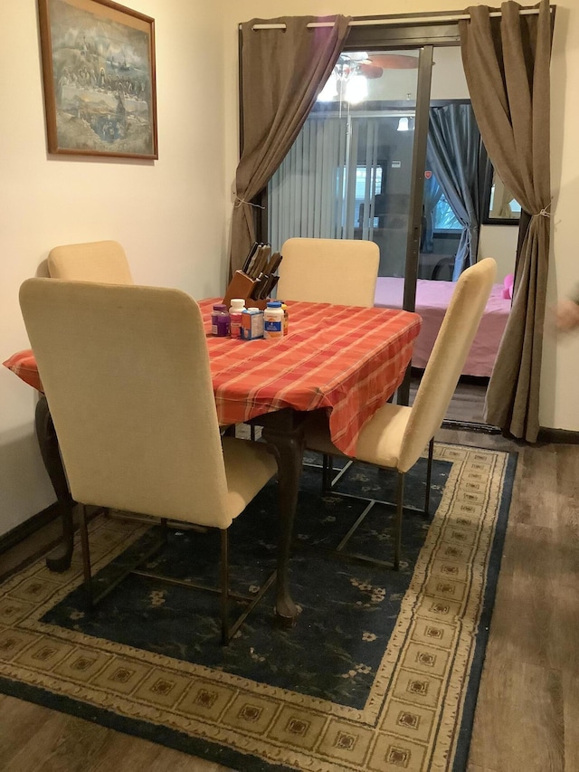 dining space featuring hardwood / wood-style floors