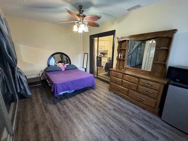 bedroom featuring dark wood-type flooring and ceiling fan