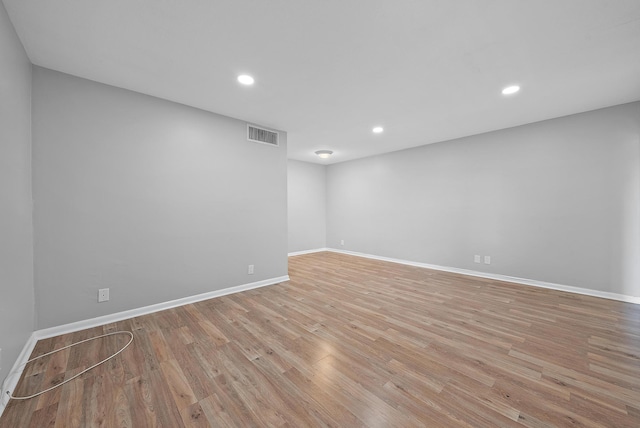 empty room with light hardwood / wood-style flooring