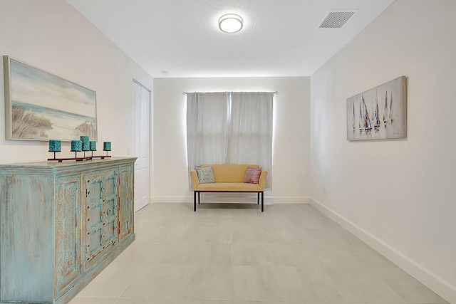 sitting room featuring light tile patterned flooring