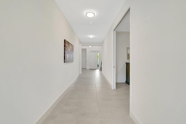 hall with light tile patterned flooring