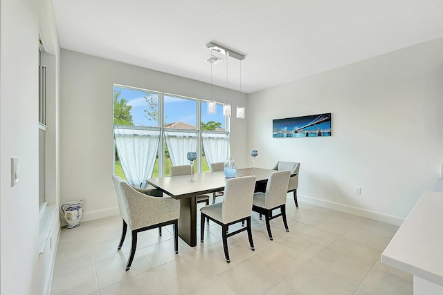 dining area with light tile patterned floors