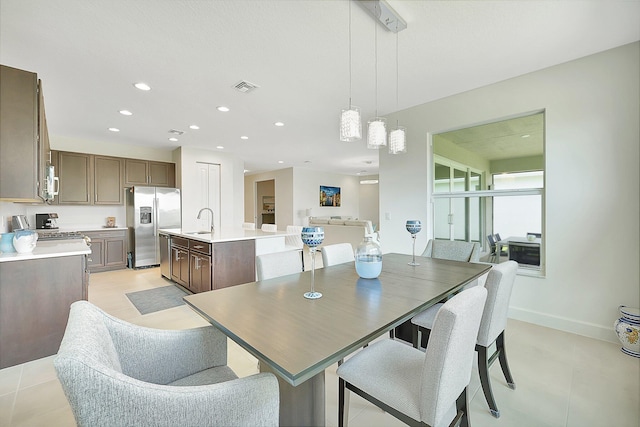 dining space featuring sink