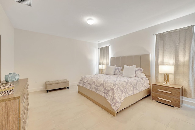 bedroom featuring light tile patterned flooring