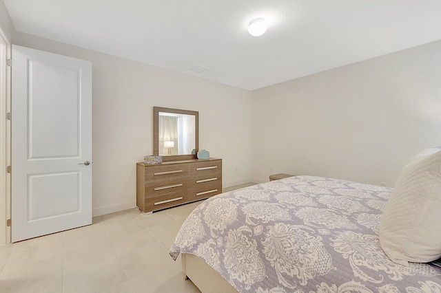 bedroom featuring light tile patterned floors