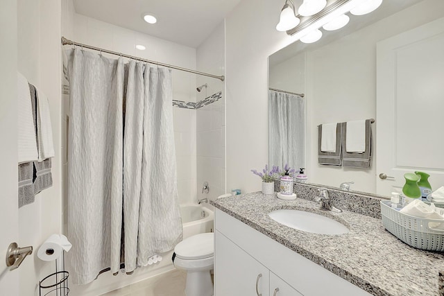 full bathroom featuring shower / bath combination with curtain, tile patterned flooring, vanity, and toilet