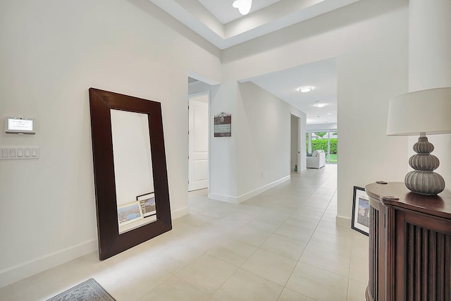 hall with light tile patterned flooring