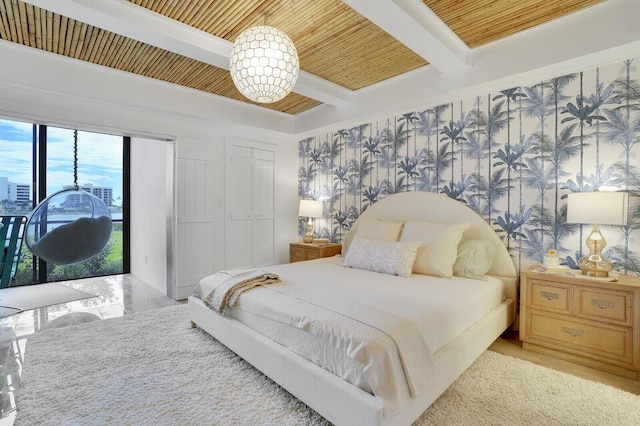 bedroom featuring access to exterior, wood ceiling, and beam ceiling