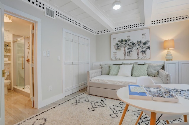 living area with visible vents and baseboards