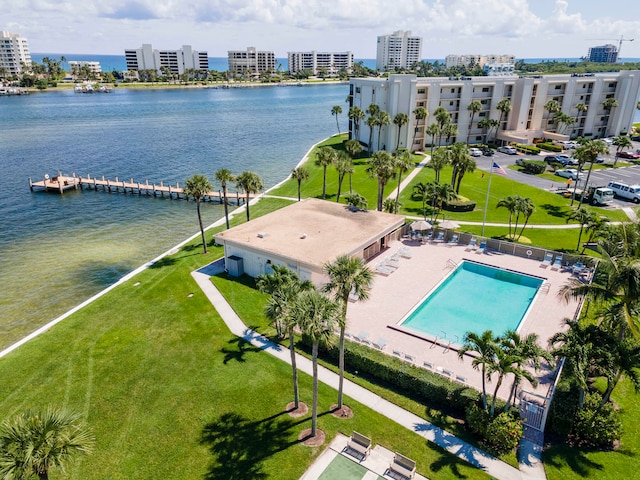 birds eye view of property featuring a water view and a city view