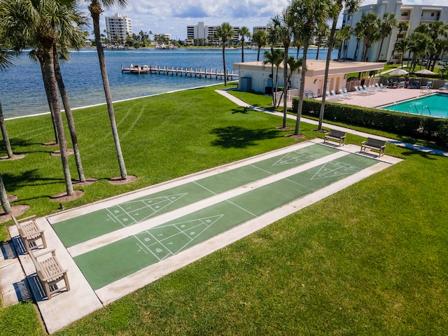 surrounding community featuring a water view, shuffleboard, and a lawn