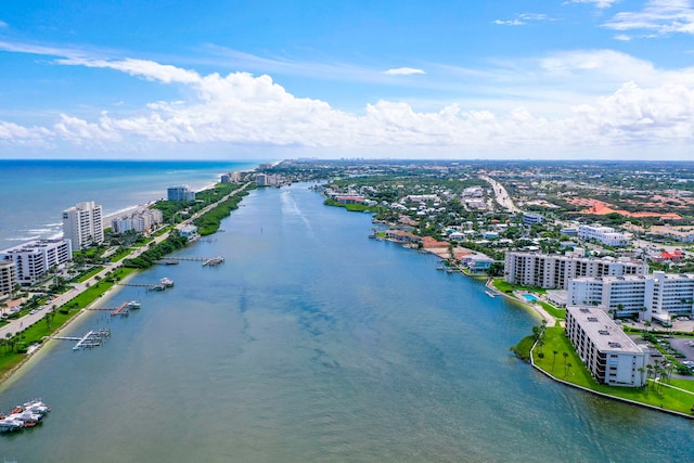 birds eye view of property featuring a view of city and a water view