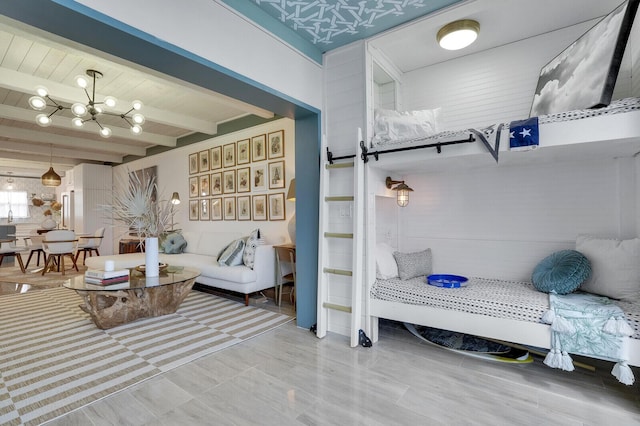 interior space featuring beam ceiling and an inviting chandelier