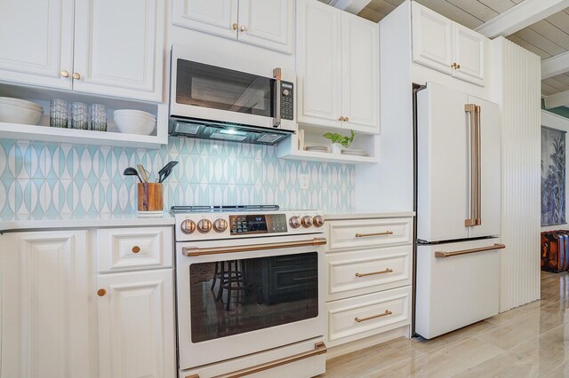 kitchen featuring open shelves, white appliances, backsplash, and light countertops