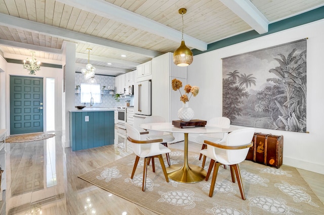 dining area with baseboards, wood ceiling, light wood-style flooring, an inviting chandelier, and beam ceiling