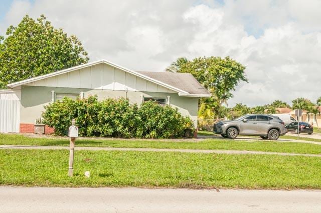 view of home's exterior featuring a yard