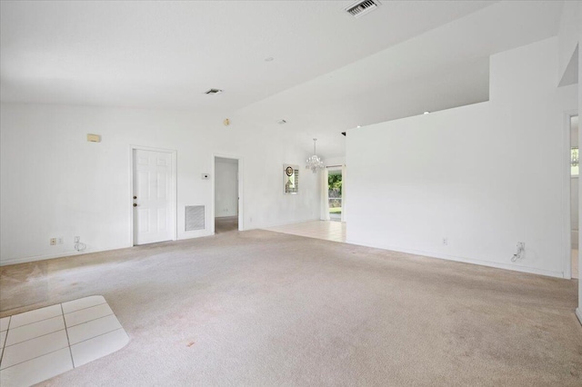 unfurnished living room with light carpet, lofted ceiling, and an inviting chandelier