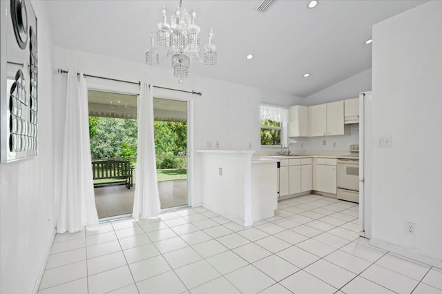 kitchen with sink, white appliances, light carpet, a notable chandelier, and vaulted ceiling