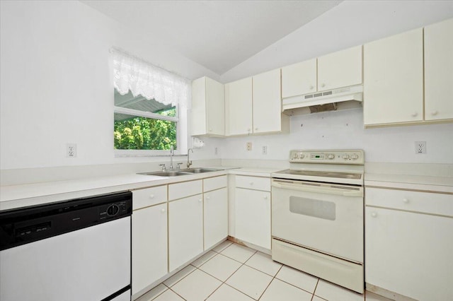 kitchen with white cabinets, light tile patterned floors, and white appliances