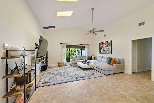 tiled living room featuring ceiling fan and high vaulted ceiling