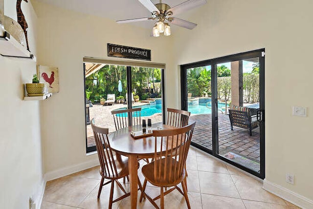 dining area with ceiling fan, plenty of natural light, and light tile patterned floors