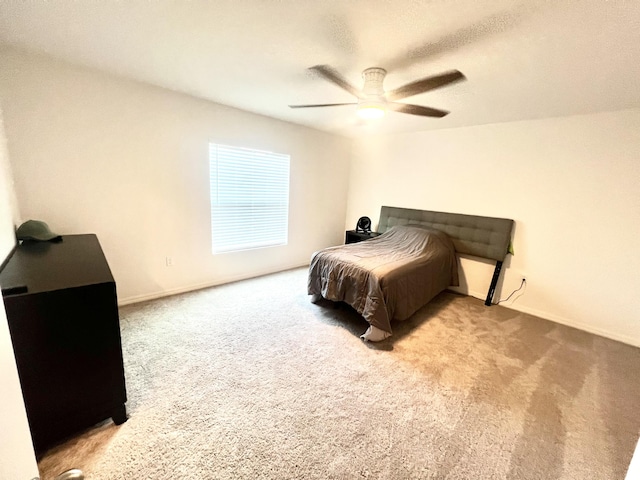 bedroom with light carpet and ceiling fan