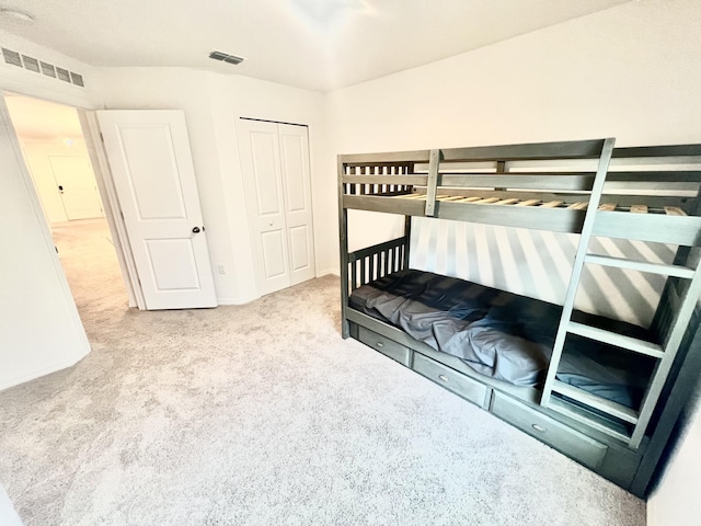 bedroom with a closet and carpet flooring