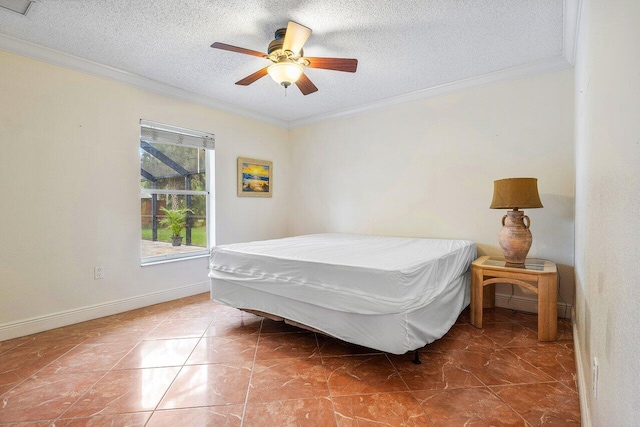 bedroom featuring ceiling fan, crown molding, and a textured ceiling