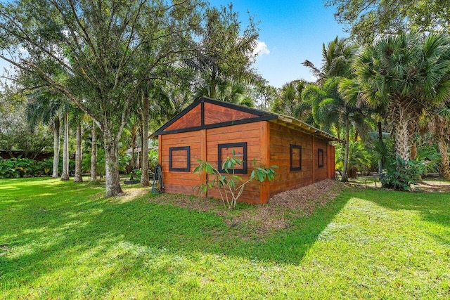 view of outdoor structure with a lawn