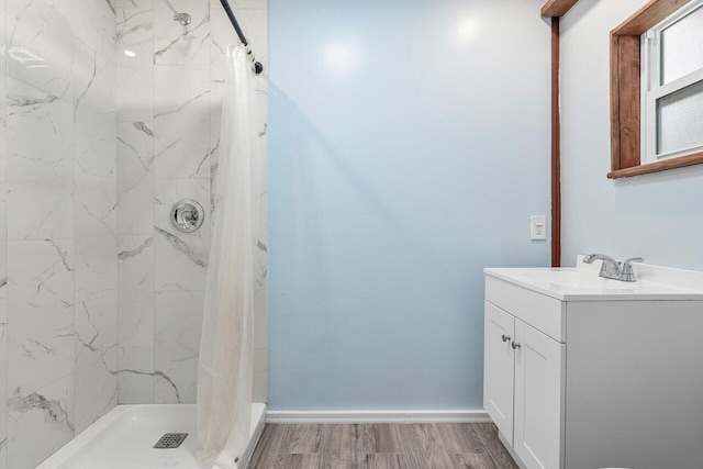 bathroom featuring vanity, hardwood / wood-style floors, and a shower with shower curtain