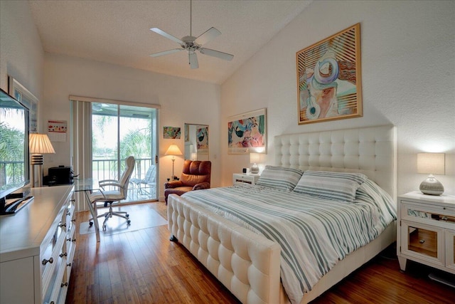 bedroom featuring a textured ceiling, access to exterior, dark wood-type flooring, lofted ceiling, and ceiling fan