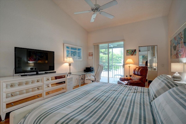 bedroom with access to outside, hardwood / wood-style floors, high vaulted ceiling, and ceiling fan