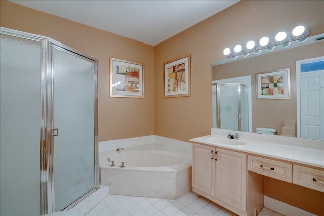 full bathroom with tile patterned floors, toilet, vanity, and separate shower and tub