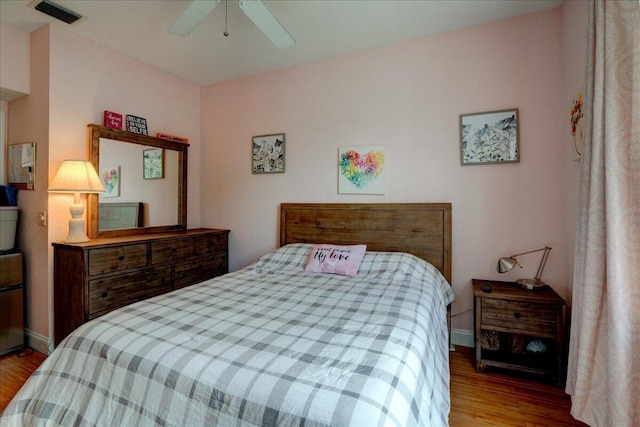 bedroom featuring ceiling fan and light hardwood / wood-style flooring